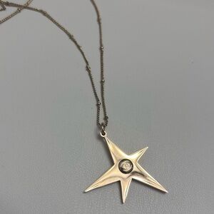 Chanel Beauty Gold Star Pendant on House of Harlow Chain Necklace